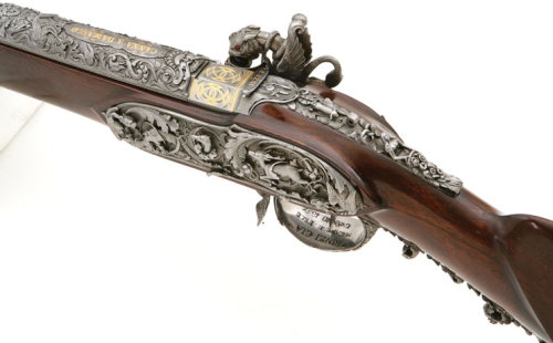 A heavily engraved and chiseled percussion muzzleloading rifle crafted by Giacomo Rinzi of Milan, ci