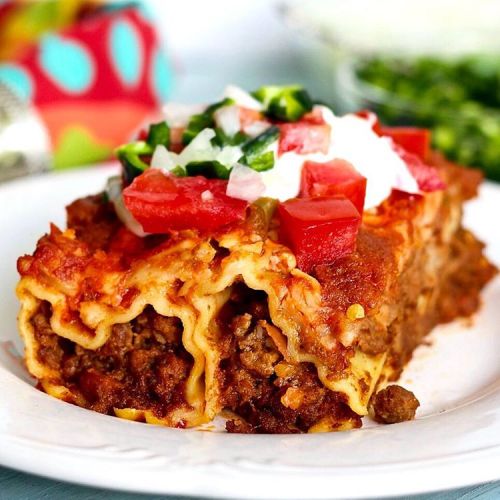 Mexican Manicotti Casserole is good ole comfort food. This is a great potluck recipe! Easy to assemb