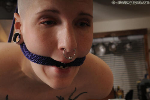 bondage-ponygirls-and-more: What goes better with a huge septum ring than a shaved head? (Ivy Thornt