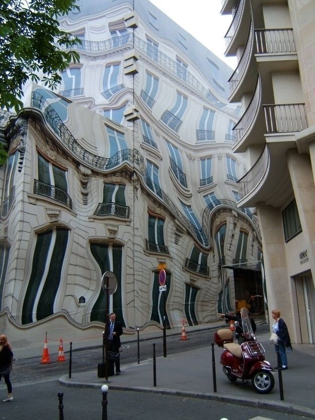 maxlikesit:    abstract tarp put over a building while under construction  