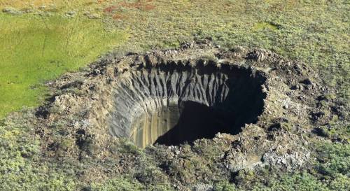 creaturing:An aerial view from onboard a helicopter taken on August 25, 2014 shows a crater on the Y