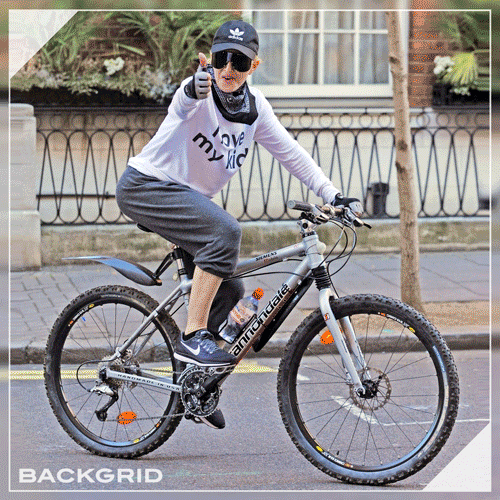 Backgrid Exclusive! Madonna leads the way on a London cycle ride! 🚵🏻‍♂️[[MORE]]Mama bear Madonna leads her brood on a cycle ride in sunny London. The mum of 6 was joined by daughter Mercy and some friends and wore a slogan t with ‘I Love My Kids’...