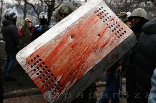 freexcitizen:rococo-girls-shrine:Blood-soaked sheild with bullet holes in it.20 Feb 2014, Kiev, Ukra