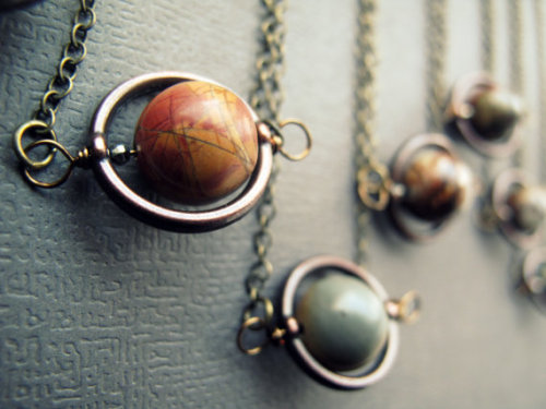 tessaviolet:wickedclothes: Planet NecklacesThese planetary necklaces aren’t just of our own so