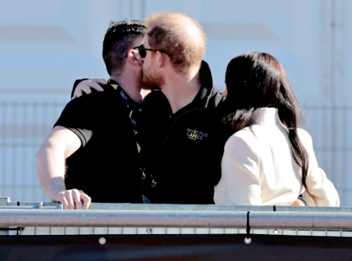 The Duke and Duchess of Sussex greet paralympian Dave Henson at the Invictus Games athletics events 