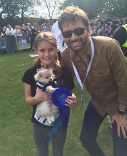 promisedyouforever:  davidtennantontwitter:    Photo (edited by us) of David Tennant at the Chiswick Dog Show today      Or - Tentoo and daughter Ruthie at the Chiswick Dog Show, with Rose behind the camera. Rose wanted a golden retriever, but if life
