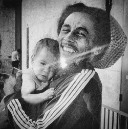 jahblessbobmarley:  Rare picture of Bob Marley holding Damian 