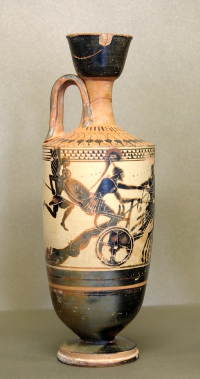 Achilles drags the body of Hector behind his chariot.  Attic white-ground black-figure lekythos, att