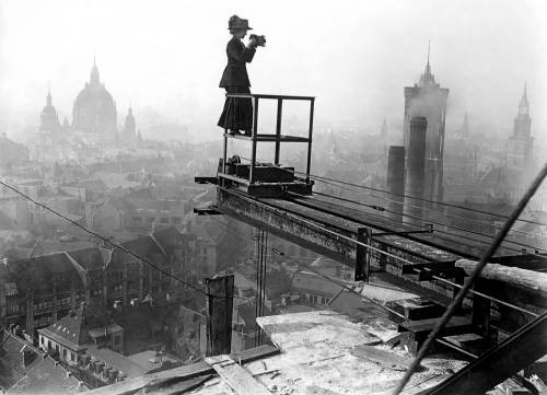 semioticapocalypse:Female photographer over the Altes Stadthaus construction site looking to Molkenmarkt Spandauer Str. In the backgrouynd: Dom, Rotes Rathaus and Marienkirche. Berlin. 1909