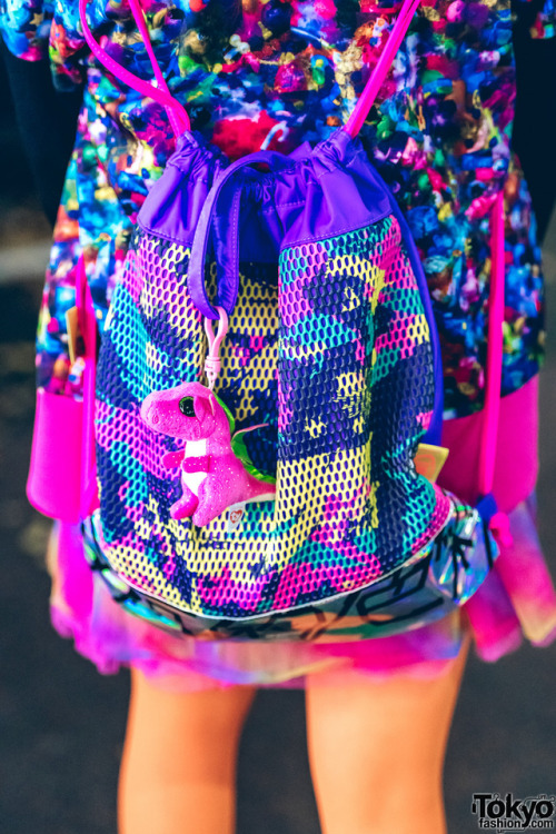 Japanese art student Chami on the street in Harajuku wearing a super colorful kawaii look with items