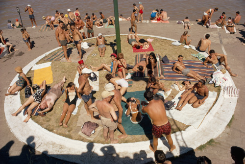 People in Buenos Aires, Argentina, flock to municipal riverside beaches to relax in the sun, Novembe