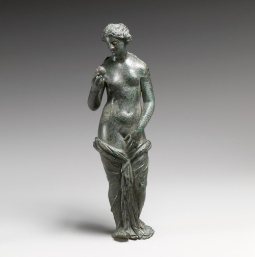 Bronze statuette with silver eyes, depicting the goddess Aphrodite.  Artist unknown; 3rd - 1st cent.