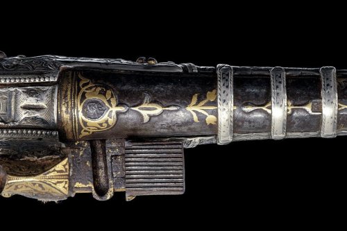 A finely engraved gold and silver decorated Cossack&rsquo;s pistol, early 19th century.Estimated Val