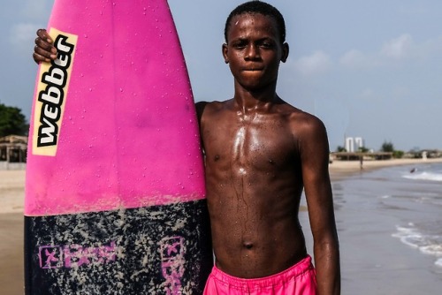 Monday is a young surfer on Tarkwa Bay, Lagos. He learnt mostly by observing and practice - spends a