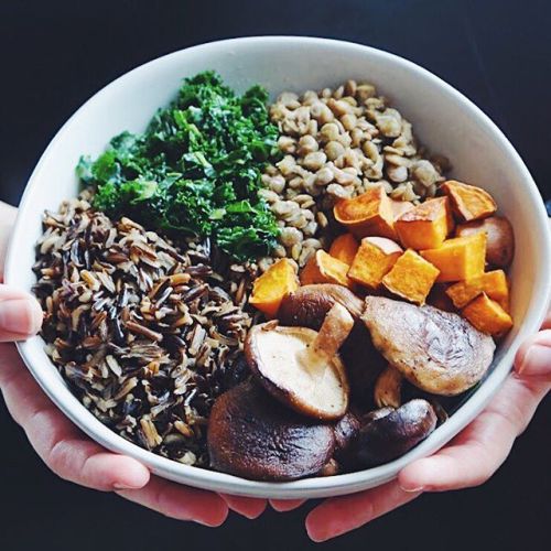 Celebrating today with a grounding buddha bowl with wild rice mushrooms lentils kale and sweet potat