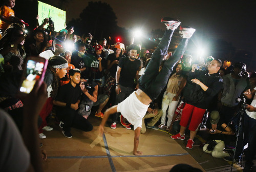 yahoonewsphotos: The peaceful side of the Ferguson protests Nightly chaos in the St. Louis suburb is