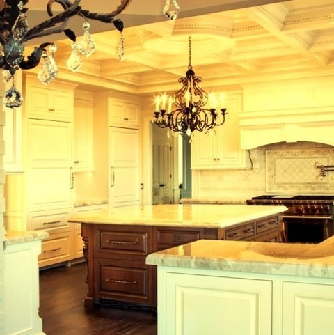 Traditional Kitchen - EnclosedA Sizable, Elegant, Enclosed Kitchen With A Dark Wood Floor And Raised