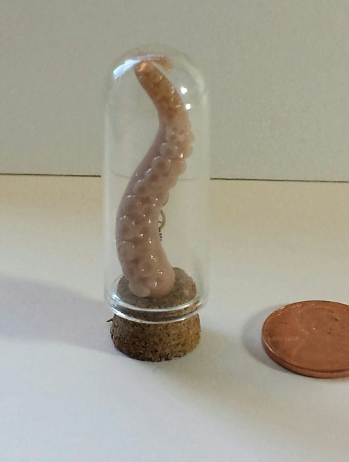 Clockwork plus polymer clay tentacles equals mad science! The tentacle is hand sculpted, Penny shown