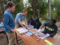 Greg Jongsma (left; MSc student at San Francisco State University) and Dan Portik (next left; PhD student at UC-Berkeley) leading practice sessions in preserving specimens for scientific research.