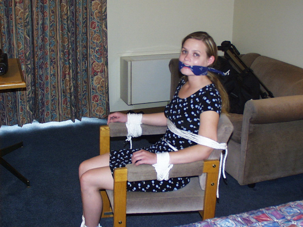 graybandanna:  Tied to a chair with a big blue bandanna gag 