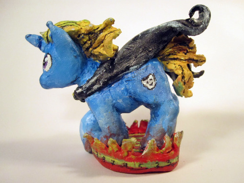 When you play a Dungeons and Dragons game set in the My Little Pony Universe, you need a pony miniature. This is Wiely Mane; he is an immature, borderline psychopathic unicorn, obsessed with comics (especially batman). He was built using Super Sculpey,