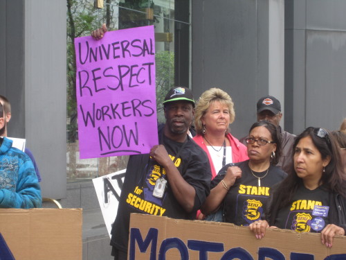 Columbus janitors, security officers and community members rallied on Monday to call on business lea