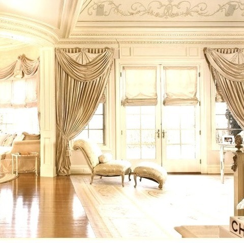 Master Bedroom Huge, Elegant Master Bedroom With Beige Walls, A Standard Fireplace, And A Stone Fireplace
