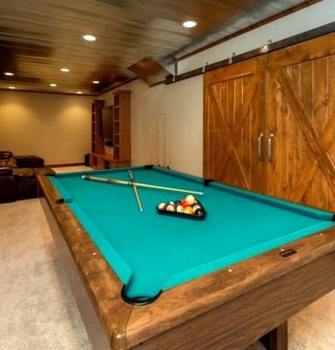 Basement - Walk OutLarge Transitional Walk-out Basement Design Featuring Carpeting, Beige Walls, A Wood