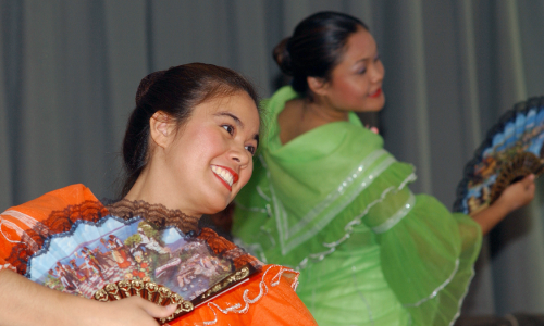 Philippine American Cultural Arts Society dancers perform a traditional courtship dance during an As