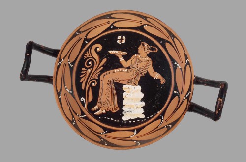 theancientwayoflife:~ Drinking cup (kylix) with seated woman with phiale.Culture: Greek, South Itali