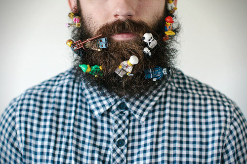 brain-food:  Photographer Stacy Thiot’s Tumblr project, Will It Beard, involves her husband’s beard and sticking as many unusual things as she can find in the thick thicket of facial hair—and then taking photographs of it. 