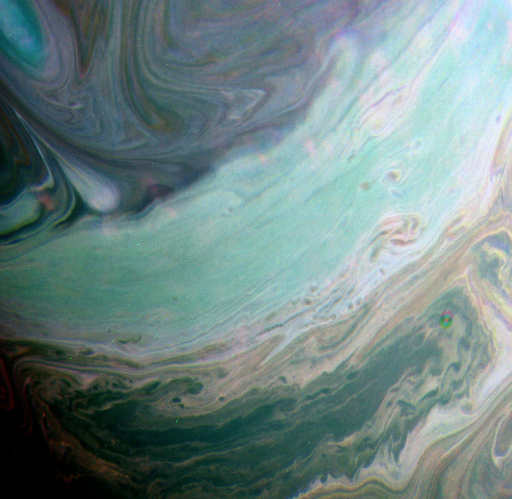 astronomyblog:  Saturn’s atmosphere exhibits a banded pattern similar to Jupiter’s,