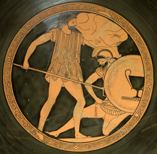 Poseidon, trident in hand, duels the Giant Polybotes during the Gigantomachy.  Tondo of an Attic red