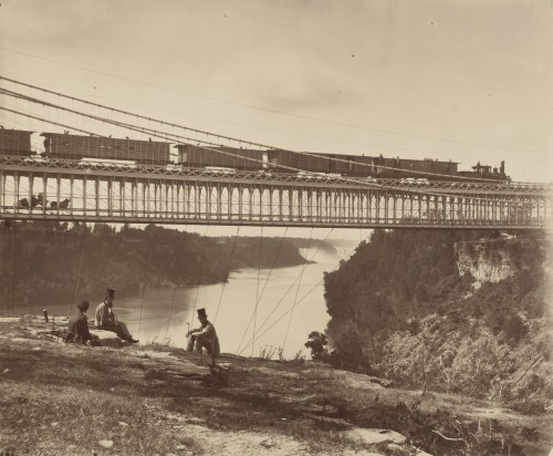 Picnicing by the Niagara Railroad Bridge, Niagara Falls, New York.Built by engineer John Roebling of