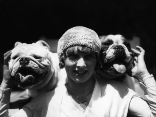 1929. A lady with two champions