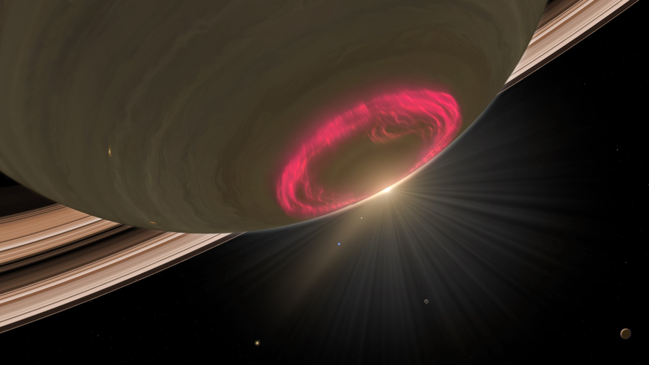 astronomyblog:    These swirls of red light are an aurora on the south pole of Saturn. Image: