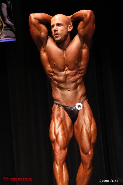 muscledlust:  Mmm…  lusting here.  Bald, handsome, sticky out ears, narrow waist, and ripped bod.  I want him.