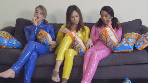 “Cheetos Triple Play” is now for sale at www.seductivestudios.com In this custom video, three girls wearing PVC body suits are enjoying multiple bags of Cheetos. They flirt, kiss each other all while eating Cheetos. Eventually Nicole and Whitn