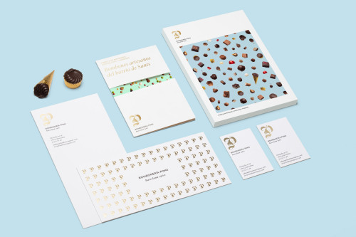 Rebranding for a chocolatier in Spain. The complementary photography of the bombones against baby bl