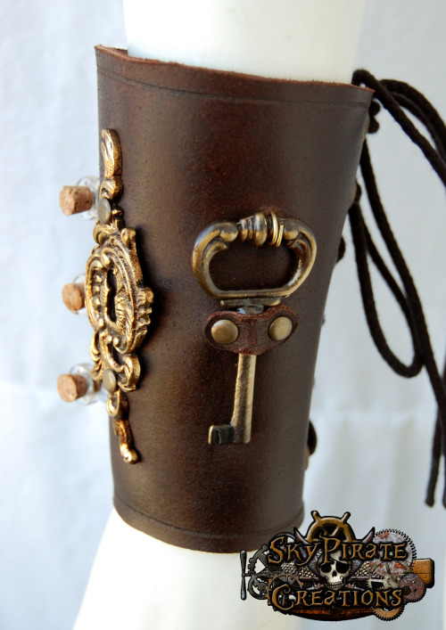 skypiratecreations:  The Alchemist Leather Bracerhttps://www.etsy.com/listing/151608719/steampunk-the-alchemist-leather-bracer?ref=shop_home_active_14 