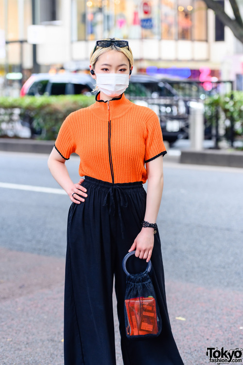 21-year-old freelancer Japanese model Saki on the street in Harajuku with an orange ribbed vintage t