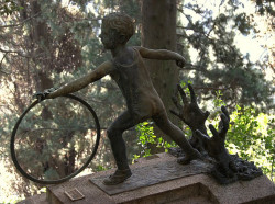 sixpenceee:  Staglieno Cemetery, Genoa, Italy. This is the grave of Italino Lacomelli, the child that died on the 16 August 1925. He was five years old and a victim of to a killer while he played in the public garden with his hoop. His mother already