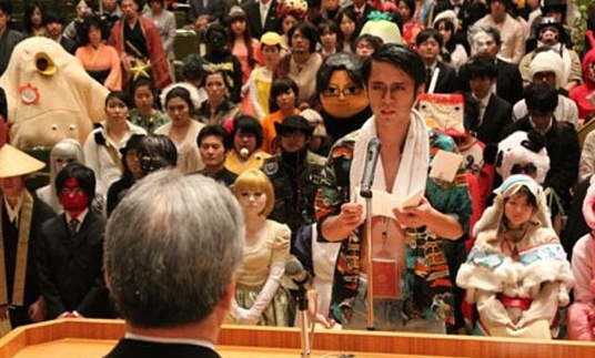 cosplaysleepeatplay:  While American students solemnly plod across a stage, be-cap