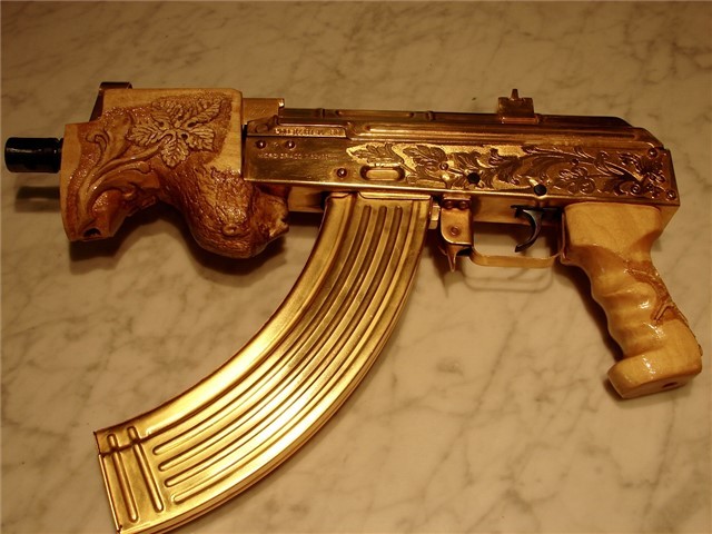 gunrunnerhell:  Bling?I think this started off as a Romanian Micro Draco Pistol but