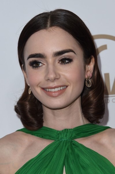 lilycollinsnews: Lily Collins attends the 28th Annual Producers Guild Awards at The Beverly Hilton H
