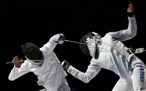 graceadee:  Switzerland’s Benjamin Steffen (L) competes against Italy’s Paolo Pizzo during their men’s team epee third place match at the World Fencing Championships in Moscow, Russia, July 18, 2015. (via) 