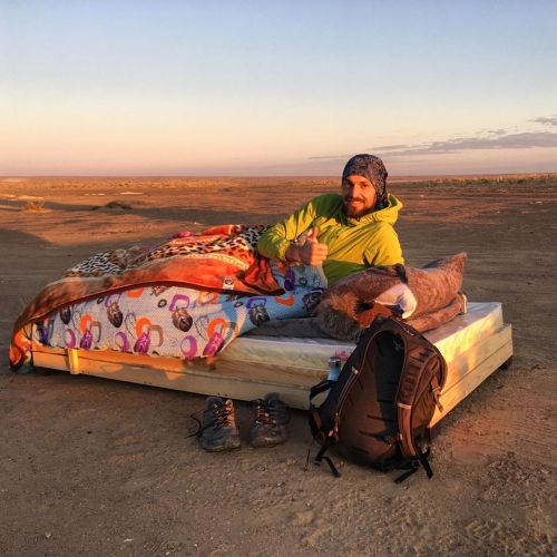 Waking up after a night sleeping under the stars next to Ayaz Kala desert in the Kyzylkum desert. Ju