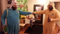 bruticub:  so the gays and lesbians in the building decided last minute to have a pajama party and watch the ball drop.   I own several onsies but i wanted to bring in the new year with my jake onesie.  Unknown to me Unionballs wore his Finn onsie.