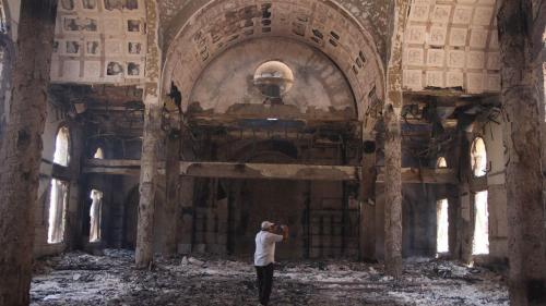 The damaged interior of the St. Moussa Church a day after it was torched in sectarian violence follo