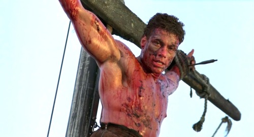 ropermike:Jean-Claude Van Damme in Cyborg (1989). More pics here.A mercenary is crucified on the mas